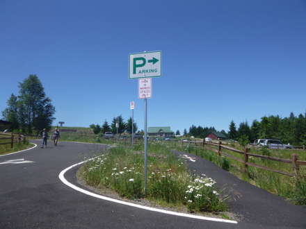 The parking lot is approximately ½ mile from the entrance